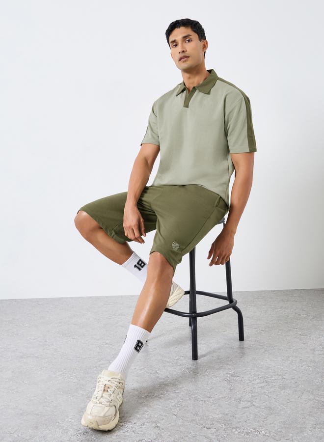 ستايلي طقم منسق من شورت وتيشيرت واسع بياقة بولو وأكمام قصيرة - Image 1